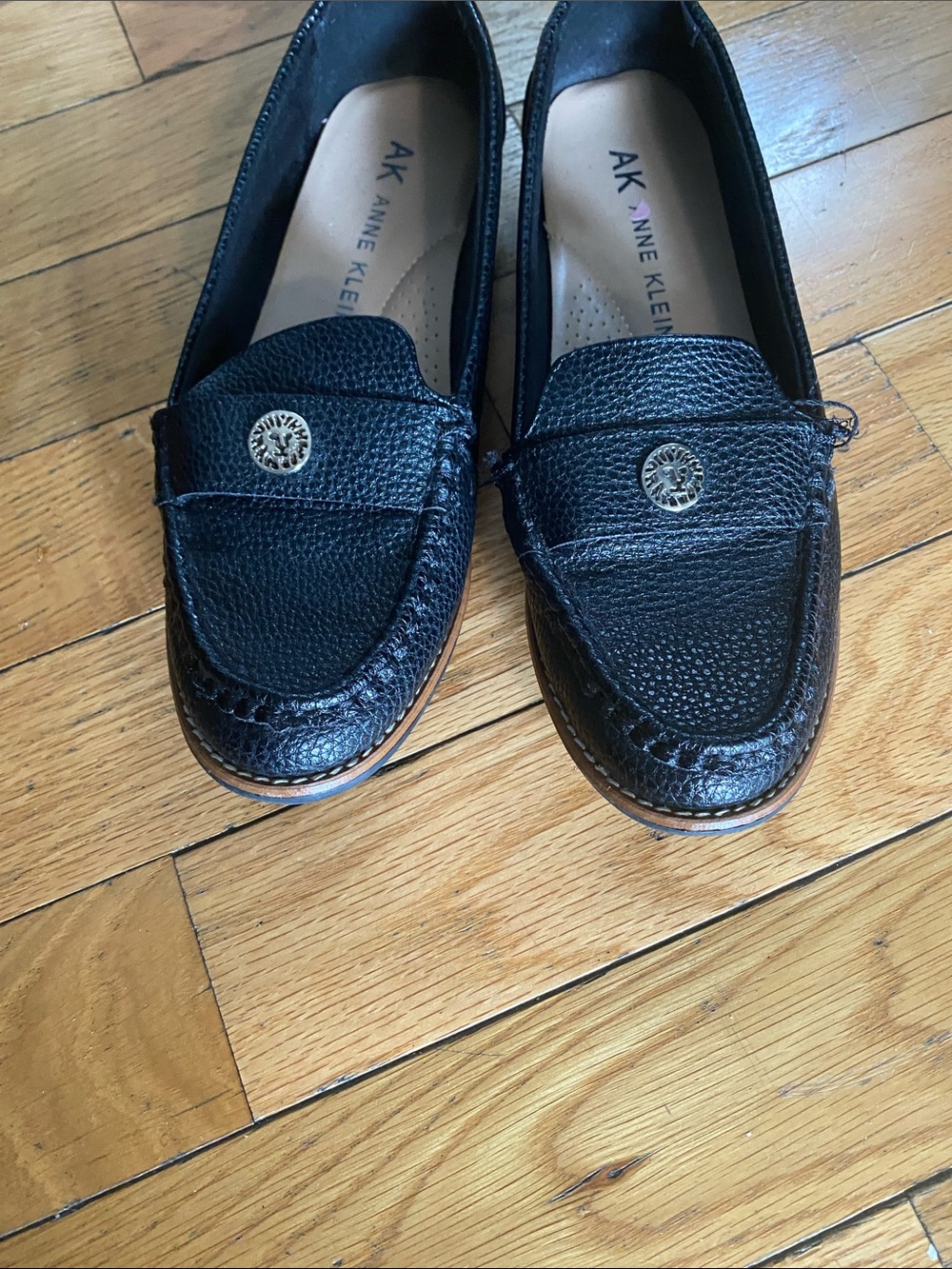 Anne Klein Black Pebbled Leather Slip-On Loafers with Gold Medallion